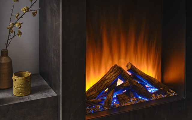 Experience the warmth and beauty of an electric fire with a blend of modern and natural aesthetics, featuring the Knightwood DRL Blue design.